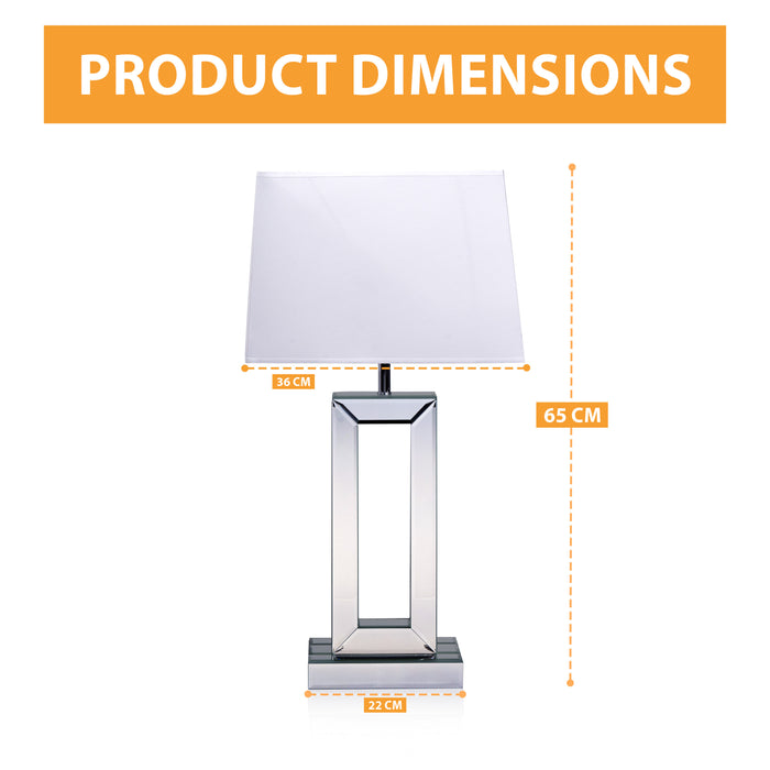 Elegant mirrored table lamp with soft lighting for a bedroom decor.