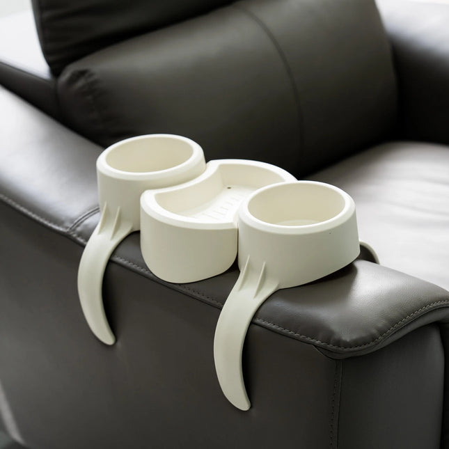 White cup holder on a black leather armchair