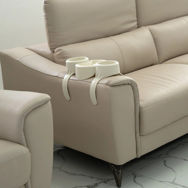 Beige sofa with a decorative item on it in a room setting