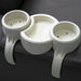 White plastic organizer with three compartments on a dark surface